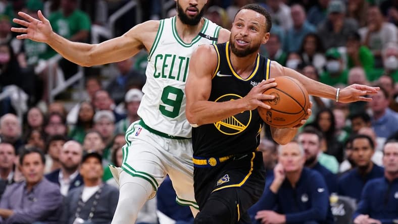 Jun 10, 2022; Boston, Massachusetts, USA; Golden State Warriors guard Stephen Curry (30) drives the ball against Boston Celtics guard Derrick White (9) in the first quarter during game four of the 2022 NBA Finals at TD Garden. Mandatory Credit: David Butler II-USA TODAY Sports
