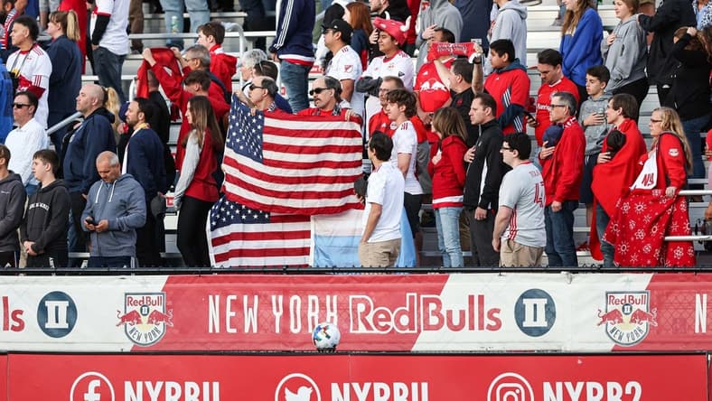 May 25, 2022; Montclair, New Jersey, USA; Fan stand for the national anthem before the game between the New York Red Bulls and Charlotte FC at Montclair State University Soccer Park. Mandatory Credit: Vincent Carchietta-USA TODAY Sports