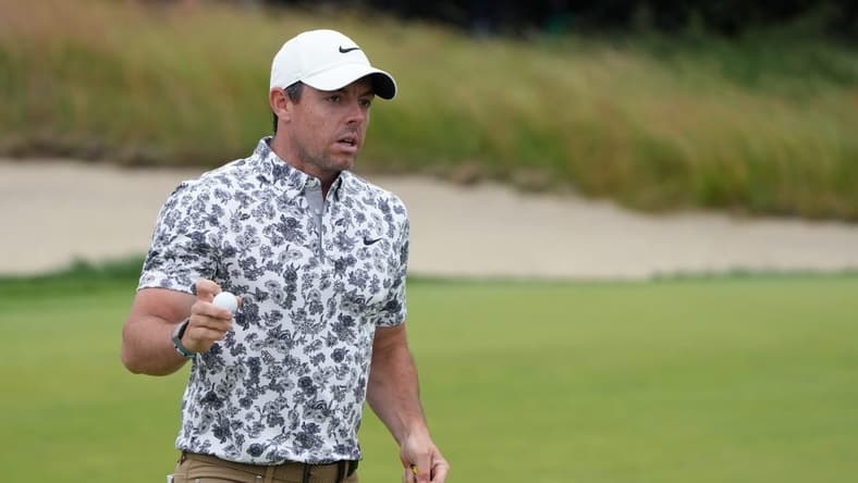 Jun 16, 2022; Brookline, Massachusetts, USA; Rory McIlroy acknowledges the crowd after a putt on the fifth green during the first round of the U.S. Open golf tournament. Mandatory Credit: John David Mercer-USA TODAY Sports