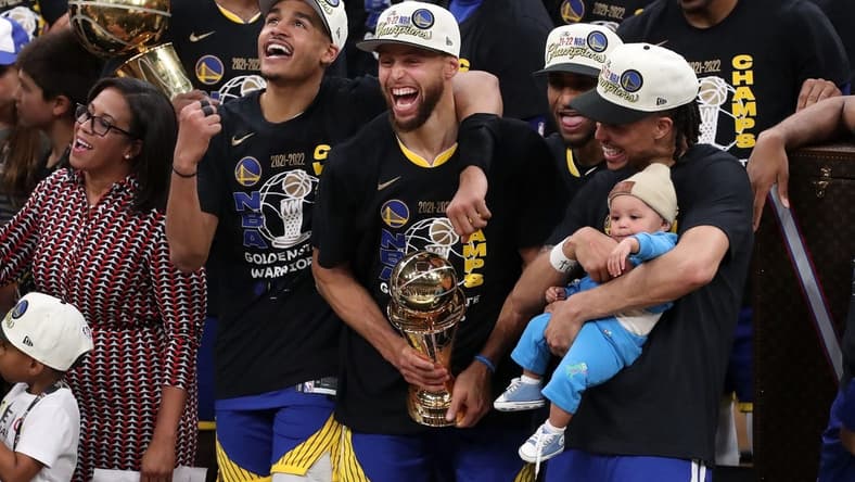 Jun 16, 2022; Boston, Massachusetts, USA; Golden State Warriors guard Jordan Poole (3), guard Stephen Curry (30), and guard Damion Lee (1) celebrate after defeating the Boston Celtics in game six of the 2022 NBA Finals at the TD Garden. Mandatory Credit: Paul Rutherford-USA TODAY Sports