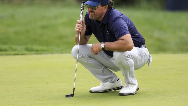 Jun 17, 2022; Brookline, Massachusetts, USA; Phil Mickelson lines up a putt on the 17th green during the second round of the U.S. Open golf tournament at The Country Club. Mandatory Credit: Aaron Doster-USA TODAY Sports