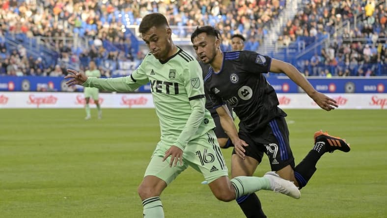 Jun 18, 2022; Montreal, Quebec, CAN; Austin FC midfielder Hector Jimenez (16) plays the ball as CF Montreal midfielder Mathieu Choiniere (29) defends during the first half at Stade Saputo. Mandatory Credit: Eric Bolte-USA TODAY Sports