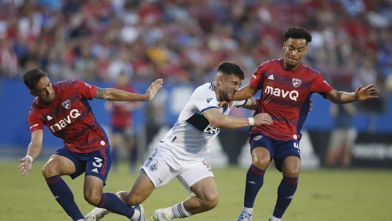 Jun 18, 2022; Frisco, Texas, USA;  Vancouver Whitecaps forward Lucas Cavallini (9) collides with FC Dallas defender Jos  Antonio Martinez (3) and Brandon Servania (18) in the first half at Toyota Stadium. Mandatory Credit: Tim Heitman-USA TODAY Sports
