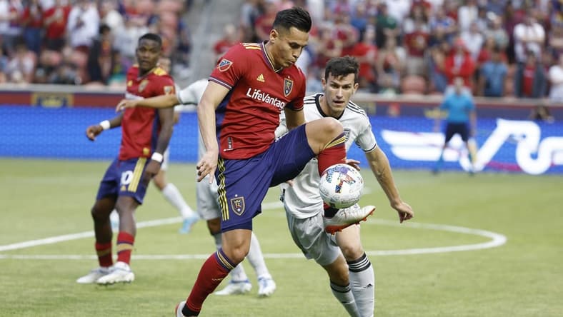 Jun 18, 2022; Sandy, Utah, USA; Real Salt Lake forward Rubio Rubin (14) and San Jose Earthquakes defender Nathan (13) battle in the first half at Rio Tinto Stadium. Mandatory Credit: Jeffrey Swinger-USA TODAY Sports