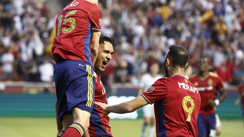 Jun 18, 2022; Sandy, Utah, USA; Real Salt Lake defender Marcelo Silva (30) is congratulated by defender Justen Glad (15) and forward Justin Meram (9) celebrates after his first half goal against the San Jose Earthquakes at Rio Tinto Stadium. Mandatory Credit: Jeffrey Swinger-USA TODAY Sports
