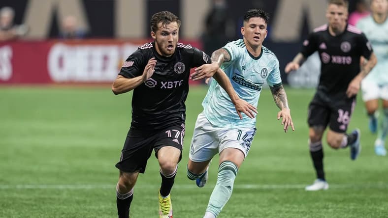 Jun 19, 2022; Atlanta, Georgia, USA; Inter Miami midfielder Indiana Vassilev (17) runs for the ball against Atlanta United midfielder Franco Ibarra (14) during the first half at Mercedes-Benz Stadium. Mandatory Credit: Dale Zanine-USA TODAY Sports