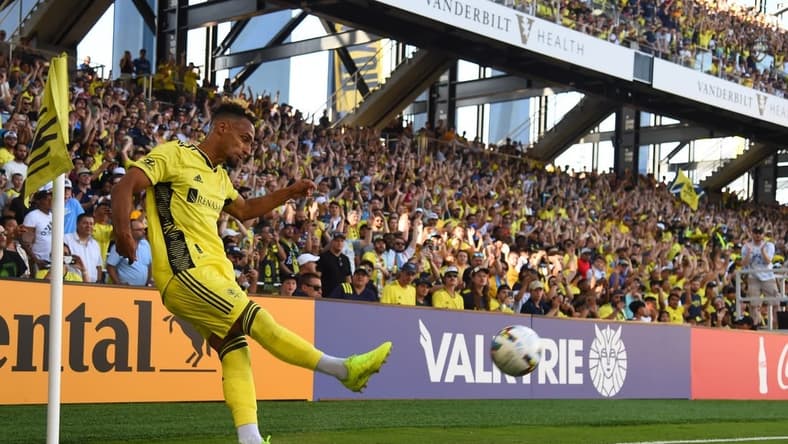 Jun 19, 2022; Nashville, Tennessee, USA; Nashville SC midfielder Hany Mukhtar (10) attempts a corner kick during the first half against Sporting Kansas City at Geodis Park. Mandatory Credit: Christopher Hanewinckel-USA TODAY Sports