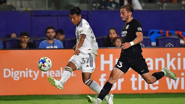 Jun 21, 2022; Carson, CA, United States; Los Angeles Galaxy midfielder Daniel Aguirre (37) passes the ball ahead of Sacramento Republic FC defender Damia Viader (3) during the second half at Dignity Health Sports Park. Mandatory Credit: Gary A. Vasquez-USA TODAY Sports