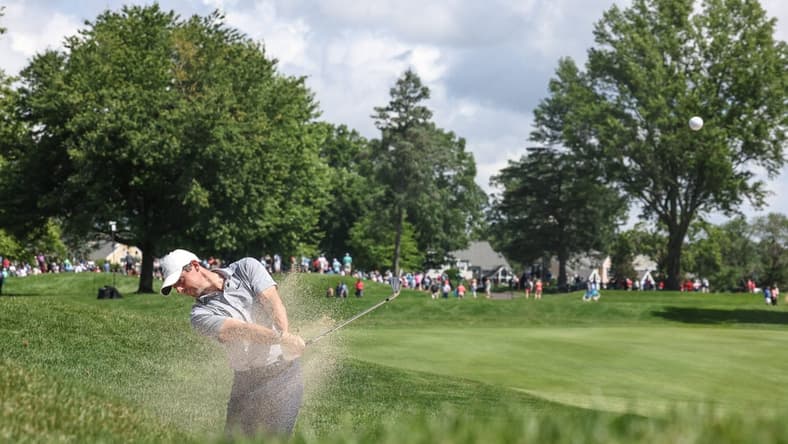 Jun 23, 2022; Cromwell, Connecticut, USA; Rory McIlroy plays a shot from a fairway bunker on the third hole during the first round of the Travelers Championship golf tournament. Mandatory Credit: Vincent Carchietta-USA TODAY Sports