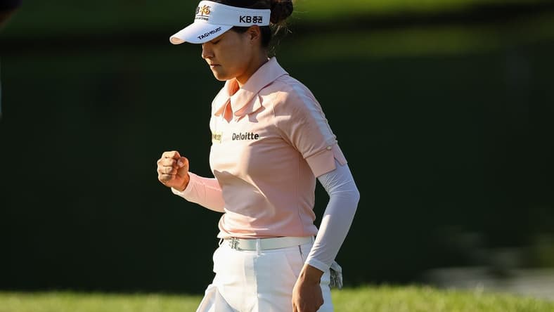 Jun 24, 2022; Bethesda, Maryland, USA; In Gee Chun celebrates after making a putt on the 18th green during the second round of the KPMG Women's PGA Championship golf tournament at Congressional Country Club. Mandatory Credit: Scott Taetsch-USA TODAY Sports