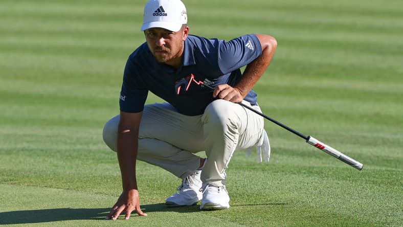 Jun 25, 2022; Cromwell, Connecticut, USA; Xander Schauffele looks over a putt on the 18th green during the third round of the Travelers Championship golf tournament. Mandatory Credit: Vincent Carchietta-USA TODAY Sports