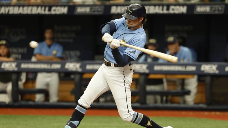 Jun 26, 2022; St. Petersburg, Florida, USA; Tampa Bay Rays center fielder Josh Lowe (15) singles during the third inning against the Pittsburgh Pirates at Tropicana Field. Mandatory Credit: Kim Klement-USA TODAY Sports