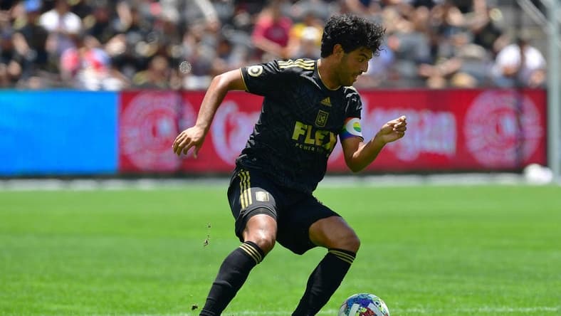 Jun 26, 2022; Los Angeles, California, USA; Los Angeles FC forward Carlos Vela (10) controls the ball against New York Red Bulls during the second half at Banc of California Stadium. Mandatory Credit: Gary A. Vasquez-USA TODAY Sports