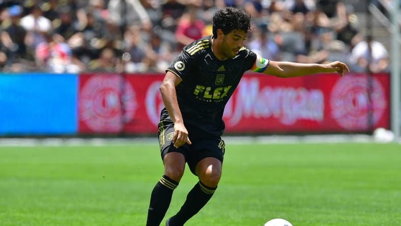 Jun 26, 2022; Los Angeles, California, USA; Los Angeles FC forward Carlos Vela (10) controls the ball against New York Red Bulls during the second half at Banc of California Stadium. Mandatory Credit: Gary A. Vasquez-USA TODAY Sports