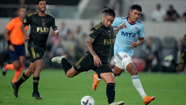Jun 29, 2022; Los Angeles, California, USA; LAFC forward Cristian Arango (9) is defended by FC Dallas midfielder Edwin Cerrillo (6) in the second half at Banc of California Stadium. Mandatory Credit: Kirby Lee-USA TODAY Sports