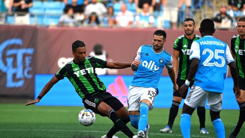 Jun 30, 2022; Charlotte, North Carolina, USA; Austin FC forward Danny Hoesen (9) and Charlotte FC midfielder Brandt Bronico (13) fight for the ball in the first half at Bank of America Stadium. Mandatory Credit: Bob Donnan-USA TODAY Sports