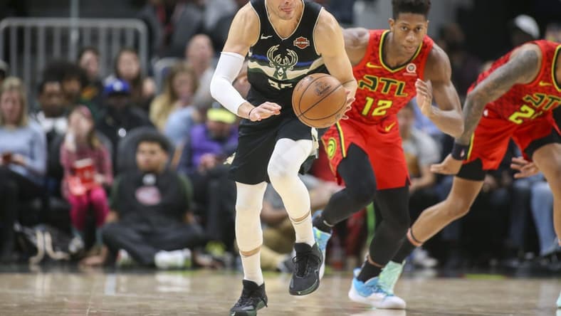 Dec 27, 2019; Atlanta, Georgia, USA; Milwaukee Bucks guard Kyle Korver (26) dribbles the ball against the Atlanta Hawks in the second half at State Farm Arena. Mandatory Credit: Brett Davis-USA TODAY Sports