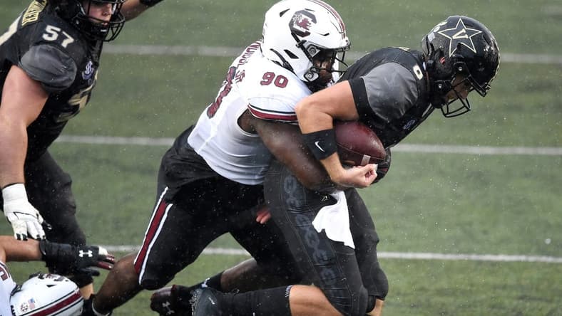 Vanderbilt quarterback Ken Seals (8) is sacked by South Carolina defensive lineman Rick Sandidge (90) during the fourth quarter at Vanderbilt Stadium Saturday, Oct. 10, 2020 in Nashville, Tenn.

Gw43366