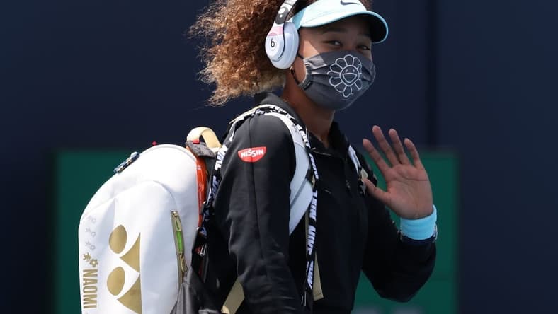 Mar 26, 2021; Miami, Florida, USA; Naomi Osaka of Japan waves while walking onto the court prior to her match against Ajla Tomljanovic of Australia (not pictured) in the second round in the Miami Open at Hard Rock Stadium. Mandatory Credit: Geoff Burke-USA TODAY Sports