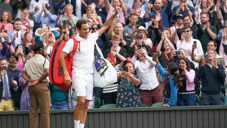 Jul 7, 2021; London, United Kingdom; Roger Federer (SUI) waving farewell to the Centre Court fans after losing to Hubert Hurkacz (POL) in the quarter finals at All England Lawn Tennis and Croquet Club. Mandatory Credit: Peter van den Berg-USA TODAY Sports