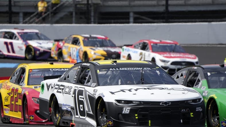 Aug 15, 2021; Speedway, Indiana, USA; NASCAR Cup Series driver AJ Allmendinger (16) during the Verizon 200 at the Brickyard at Indianapolis Motor Speedway Road Course. Mandatory Credit: Mike Dinovo-USA TODAY Sports