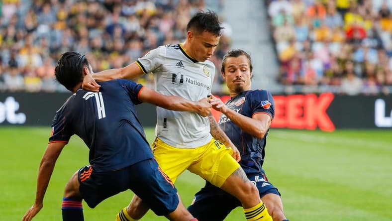 Columbus Crew midfielder Lucas Zelarayan (10) battles past FC Cincinnati forward Yuya Kubo (7) and FC Cincinnati defender Florian Valot (64) during the first half of a MLS match between the Columbus Crew and FC Cincinnati on Friday, Aug. 27, 2021 at Lower.com Field in Columbus, Ohio.
Mls Fc Cincinnati At Columbus Crew