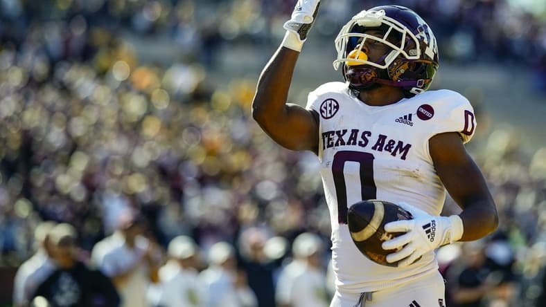 Oct 16, 2021; Columbia, Missouri, USA; Texas A&M Aggies wide receiver Ainias Smith (0) celebrates after scoring a touchdown against the Missouri Tigers during the first half at Faurot Field at Memorial Stadium. Mandatory Credit: Jay Biggerstaff-USA TODAY Sports
