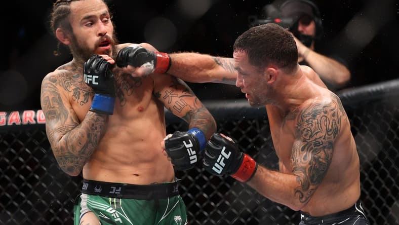 Nov 6, 2021; New York, NY, USA; Marlon Vera (blue gloves) competes against Frankie Edgar (red gloves) during UFC 268 at Madison Square Garden. Mandatory Credit: Ed Mulholland-USA TODAY Sports