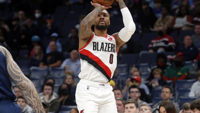Dec 19, 2021; Memphis, Tennessee, USA; Portland Trail Blazers guard Damian Lillard (0) shoots for three during the first half against the Memphis Grizzles at FedExForum. Mandatory Credit: Petre Thomas-USA TODAY Sports