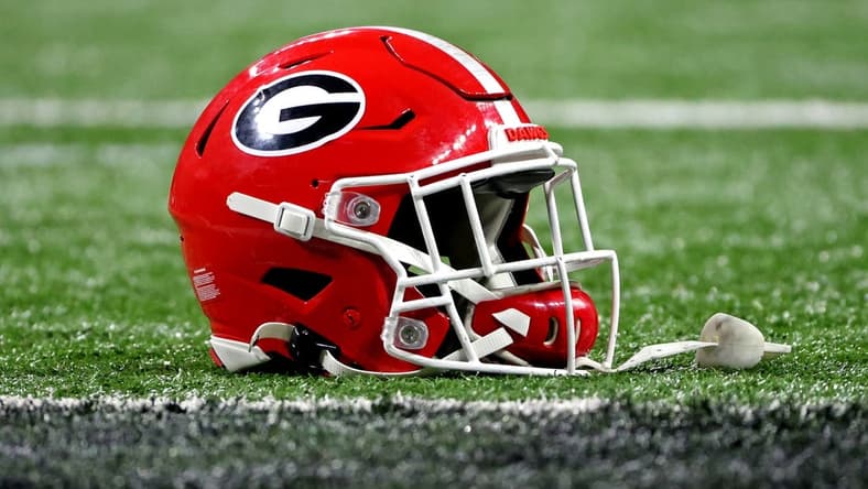 Jan 10, 2022; Indianapolis, IN, USA; A Georgia Bulldogs helmet sits on the field after the Georgia Bulldogs beat the Alabama Crimson Tide in the 2022 CFP college football national championship game at Lucas Oil Stadium. Mandatory Credit: Trevor Ruszkowski-USA TODAY Sports
