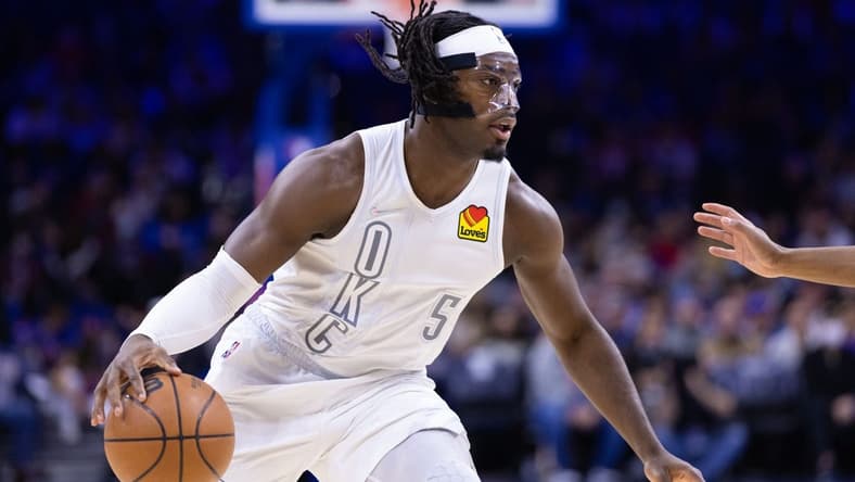 Feb 11, 2022; Philadelphia, Pennsylvania, USA; Oklahoma City Thunder forward Luguentz Dort (5) dribbles the ball against the Philadelphia 76ers during the first quarter at Wells Fargo Center. Mandatory Credit: Bill Streicher-USA TODAY Sports