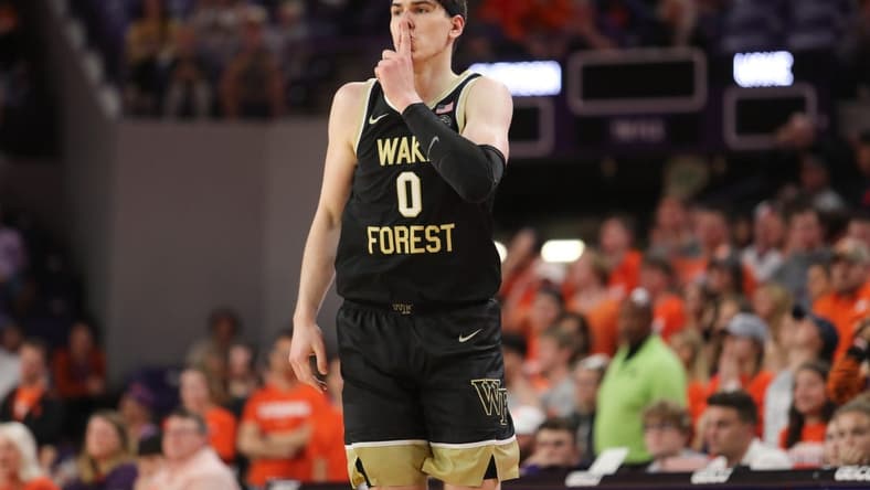 Feb 23, 2022; Clemson, South Carolina, USA; Wake Forest Demon Deacons forward Jake LaRavia (0) reacts after making a three point shot against the Clemson Tigers during the second half at Littlejohn Coliseum. Mandatory Credit: Dawson Powers-USA TODAY Sports