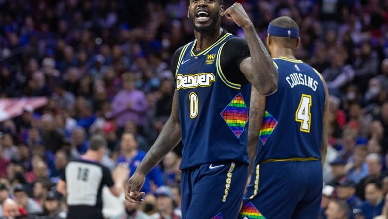 Mar 14, 2022; Philadelphia, Pennsylvania, USA; Denver Nuggets forward JaMychal Green (0) reacts to a fan during the fourth quarter against the Philadelphia 76ers at Wells Fargo Center. Mandatory Credit: Bill Streicher-USA TODAY Sports