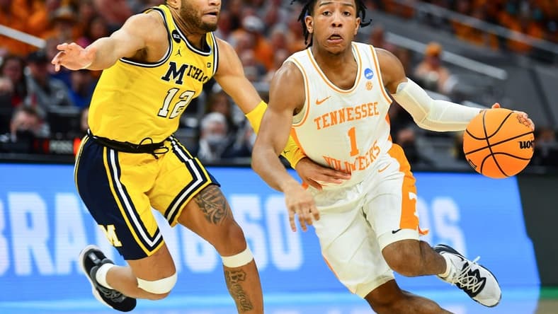 Tennessee guard Kennedy Chandler (1) is defended by Michigan guard DeVante' Jones (12) during the NCAA Tournament second round game between Tennessee and Michigan at Gainbridge Fieldhouse in Indianapolis, Ind., on Saturday, March 19, 2022.

Kns Ncaa Vols Michigan Bp