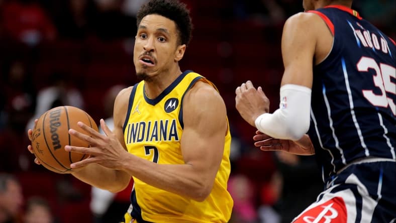 Mar 18, 2022; Houston, Texas, USA; Indiana Pacers guard Malcolm Brogdon (7) drives to the basket against the Houston Rockets during the game at Toyota Center. Mandatory Credit: Erik Williams-USA TODAY Sports
