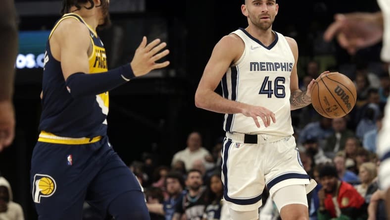 Mar 24, 2022; Memphis, Tennessee, USA; Memphis Grizzlies guard John Konchar (46) dribbles during the second half against the Indiana Pacers at FedExForum. Mandatory Credit: Petre Thomas-USA TODAY Sports