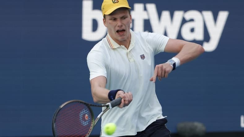 Mar 29, 2022; Miami Gardens, FL, USA; Jenson Brooksby (USA) reacts after winning a point against Daniil Medvedev (not pictured) in a fourth round men's singles match in the Miami Open at Hard Rock Stadium. Mandatory Credit: Geoff Burke-USA TODAY Sports
