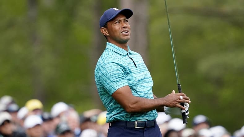 Apr 8, 2022; Augusta, Georgia, USA; Tiger Woods watches his tee shot from no. 12 during the second round of The Masters golf tournament at Augusta National Golf Course. Mandatory Credit: Danielle Parhizkaran-Augusta Chronicle/USA TODAY Sports