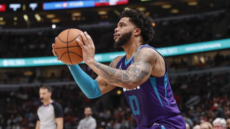 Apr 8, 2022; Chicago, Illinois, USA; Charlotte Hornets forward Miles Bridges (0) shoots against the Chicago Bulls during the second half at United Center. Mandatory Credit: Kamil Krzaczynski-USA TODAY Sports
