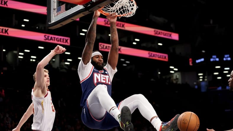 Apr 8, 2022; Brooklyn, New York, USA; Brooklyn Nets center Andre Drummond (0) dunks against Cleveland Cavaliers forward Lauri Markkanen (24) during the fourth quarter at Barclays Center. Mandatory Credit: Brad Penner-USA TODAY Sports