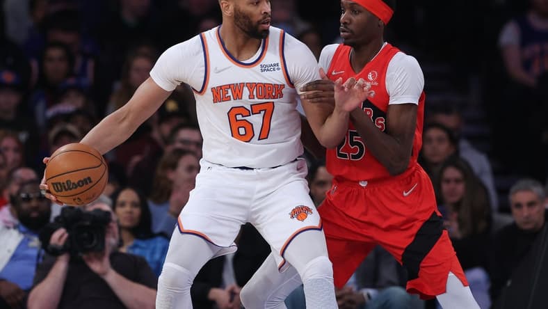 Apr 10, 2022; New York, New York, USA; New York Knicks center Taj Gibson (67) dribbles against Toronto Raptors forward Chris Boucher (25) during the first half at Madison Square Garden. Mandatory Credit: Vincent Carchietta-USA TODAY Sports