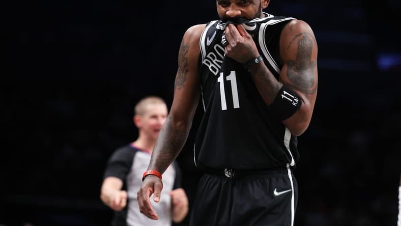 Apr 12, 2022; Brooklyn, New York, USA; Brooklyn Nets guard Kyrie Irving (11) reacts during the first half against the Cleveland Cavaliers at Barclays Center. Mandatory Credit: Vincent Carchietta-USA TODAY Sports
