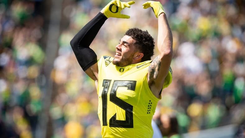 Yellow Team defensive back Bennett Williams (15) dances to Shout during the Oregon Spring Game at Autzen Stadium on Saturday, April 23, 2022.