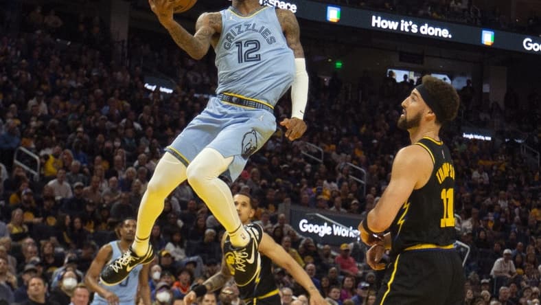 May 7, 2022; San Francisco, California, USA; Memphis Grizzlies guard Ja Morant (12) drives to the basket against Golden State Warriors guard Klay Thompson (11) during the third quarter of game three of the second round for the 2022 NBA playoffs at Chase Center. Mandatory Credit: D. Ross Cameron-USA TODAY Sports
