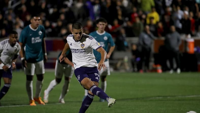 May 11, 2022; Irvine, California, USA;  Los Angeles Galaxy forward Dejan Joveljic (99) kicks penalty kick during the first half against the California United Strikers FC at Championship Soccer Stadium. Mandatory Credit: Kiyoshi Mio-USA TODAY Sports