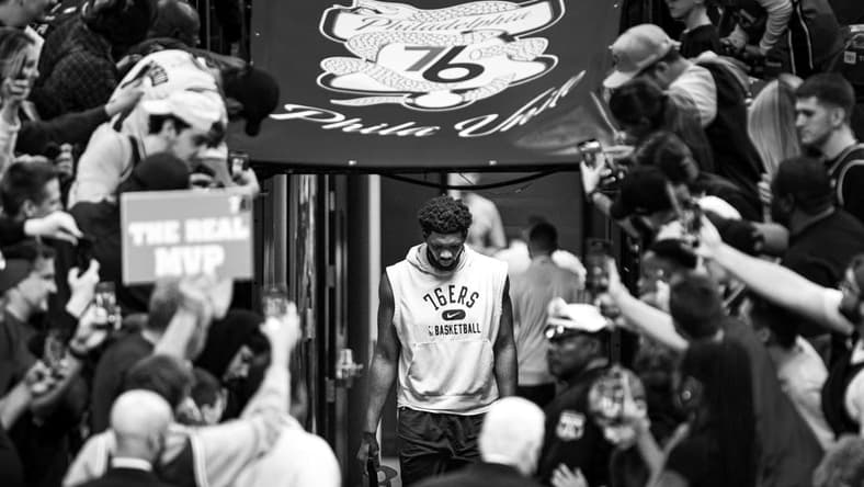 May 12, 2022; Philadelphia, Pennsylvania, USA; (original photo converted to black and white) Philadelphia 76ers center Joel Embiid walks from his locker room for warm ups against the Miami Heat in game six of the second round of the 2022 NBA playoffs at Wells Fargo Center. Mandatory Credit: Bill Streicher-USA TODAY Sports