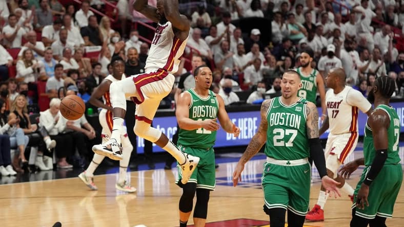 May 17, 2022; Miami, Florida, USA; Miami Heat center Dewayne Dedmon (21) dunks against the Boston Celtics during the first half of game one of the 2022 eastern conference finals at FTX Arena. Mandatory Credit: Jasen Vinlove-USA TODAY Sports