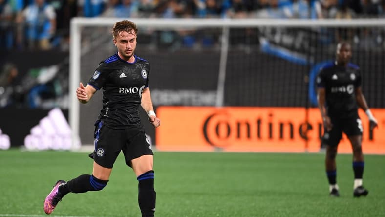 May 14, 2022; Charlotte, North Carolina, USA; CF Montreal midfielder Djordje Mihailovic (8) with the ball in the second half at Bank of America Stadium. Mandatory Credit: Bob Donnan-USA TODAY Sports