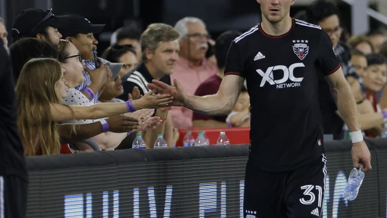 May 21, 2022; Washington, District of Columbia, USA; D.C. United defender Julian Gressel (31) shakes hands with fans while leaving the field after the game against Toronto FC at Audi Field. Mandatory Credit: Geoff Burke-USA TODAY Sports