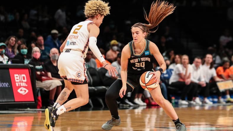 May 17, 2022; Brooklyn, New York, USA; New York Liberty guard Sabrina Ionescu (20) and Connecticut Sun guard Natisha Hiedeman (2) at Barclays Center. Mandatory Credit: Wendell Cruz-USA TODAY Sports